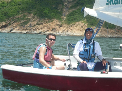 圖14:精英會籌委會成員之一的李國強(右)與教練William(左)亦師亦友